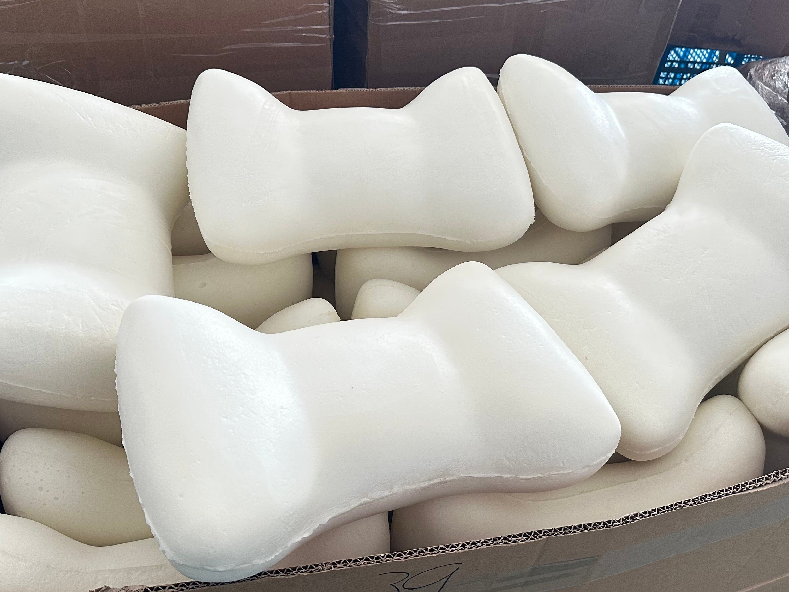 Moulded white polyurethane foam components packed in a carton