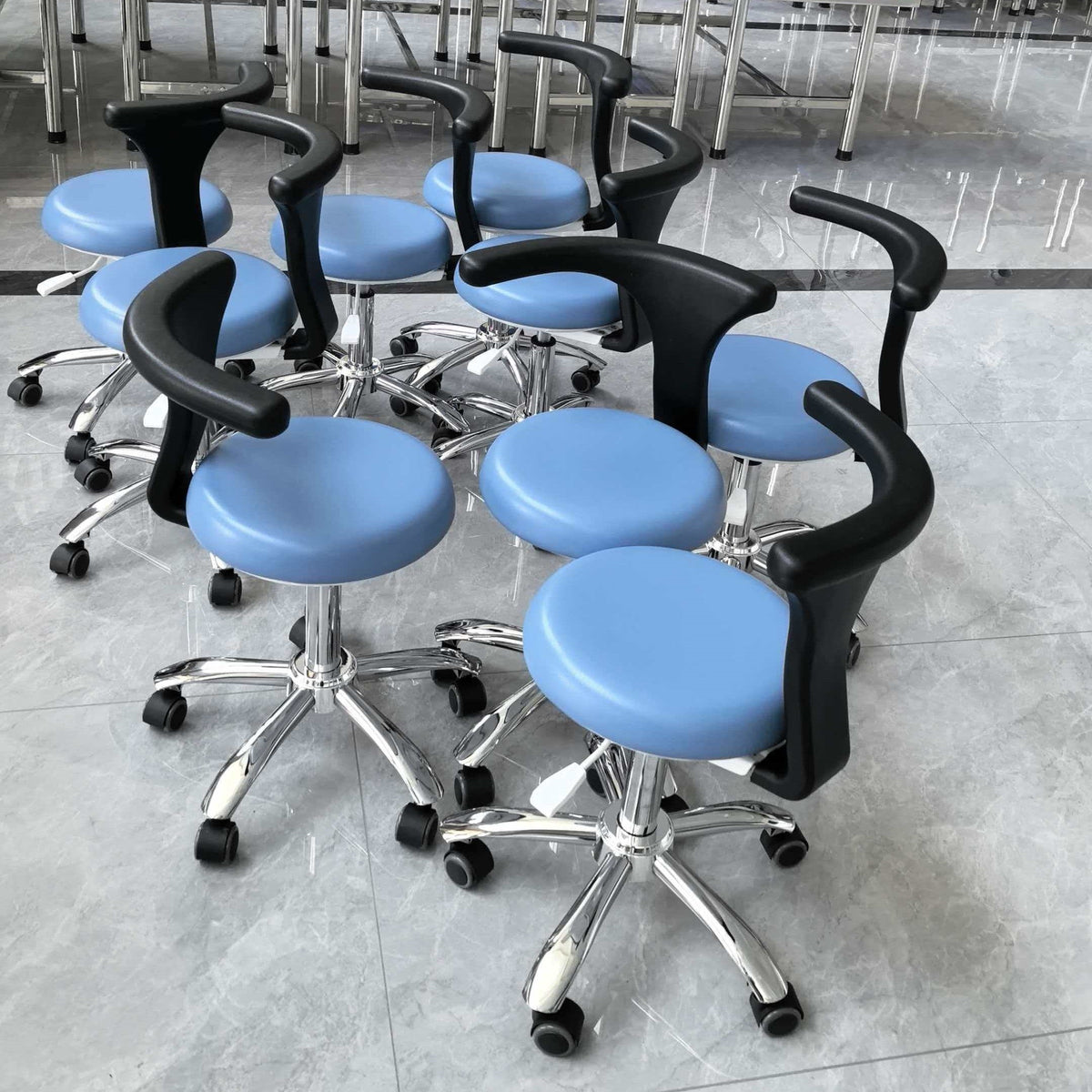 A row of DTL-ZY-01 assistant chairs in blue upholstery on chrome bases, photographed at a customer site