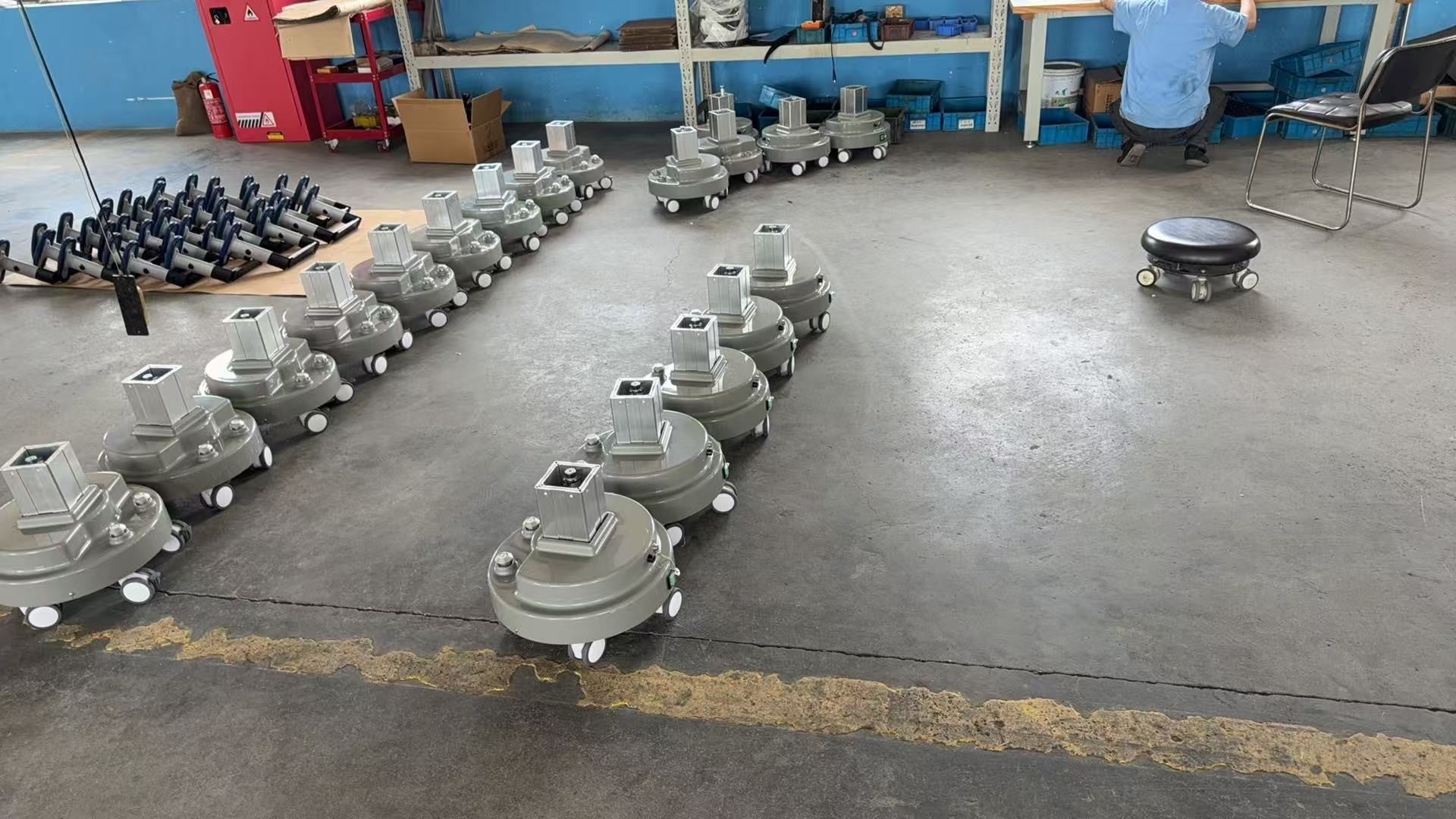 Batches of finished pedestal assemblies staged on the floor